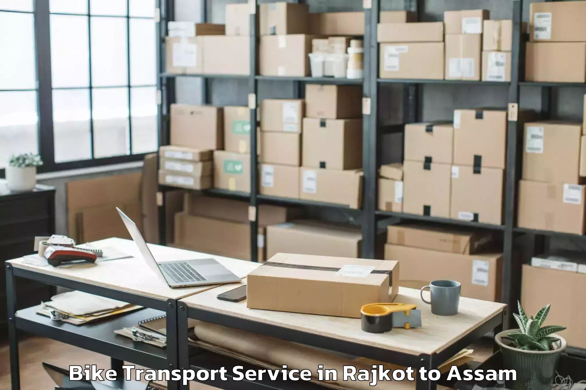 Book Rajkot to Phuloni Bike Transport Online